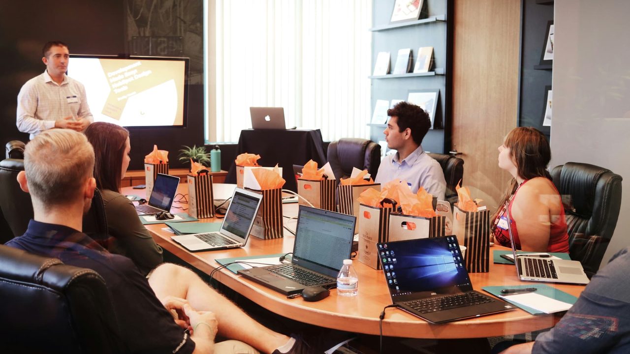 A facilitator leading a group through a working session